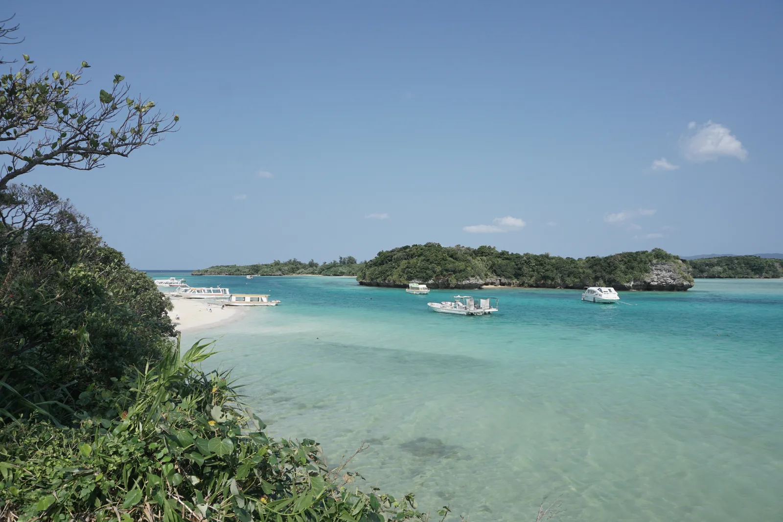 Turquoise water and small boats at Kabira Bay, Ishigaki