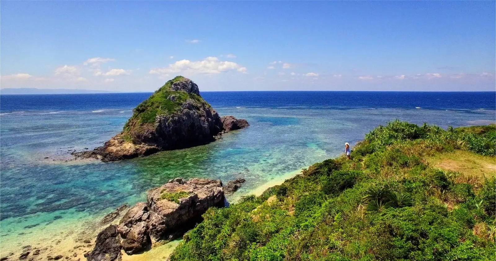 View across the green coast and blue sea from Sakieda, Ishigaki