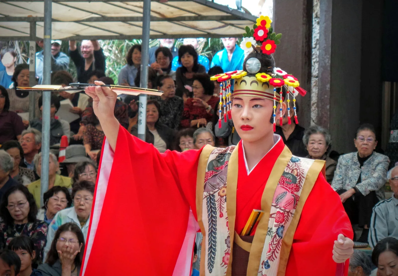 A festival performer in colourful traditional dress on Taketomi
