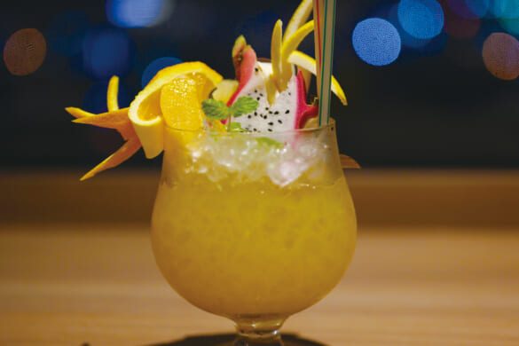 A delicious tropical fruit cocktail at a bar